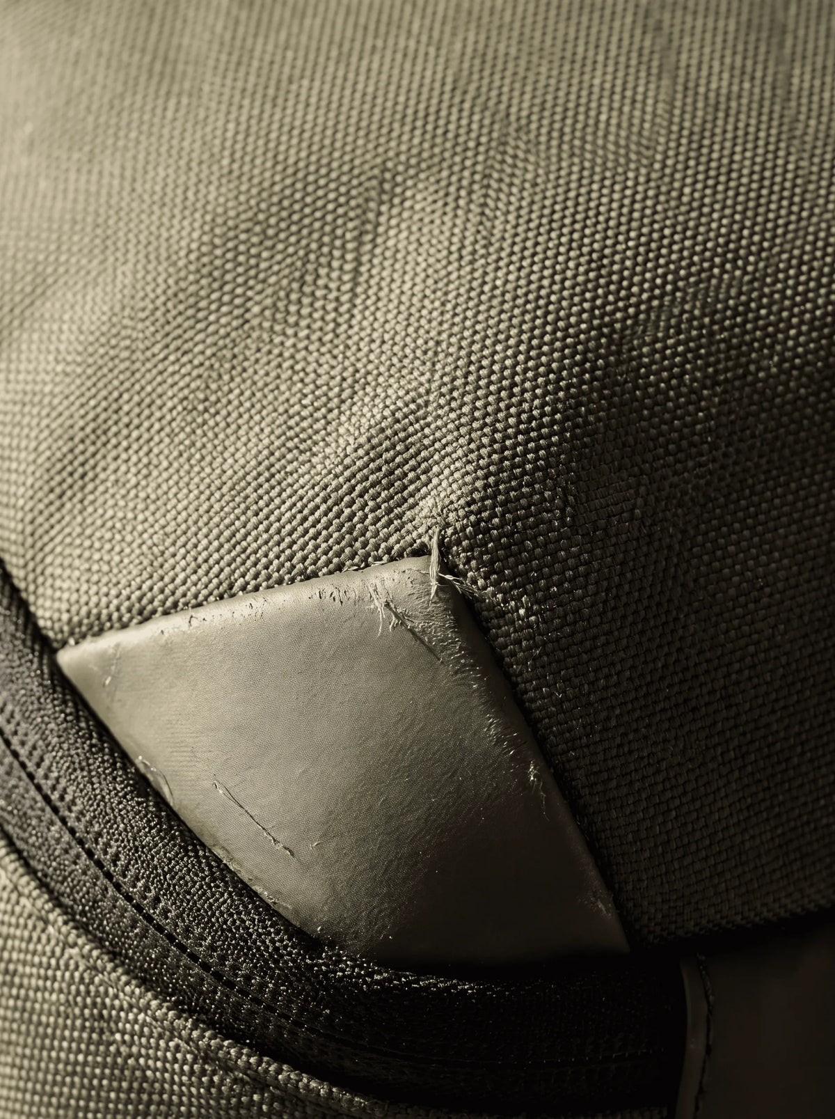 Close detail of the ProPack woven Oxford shell and its reinforced corner panel